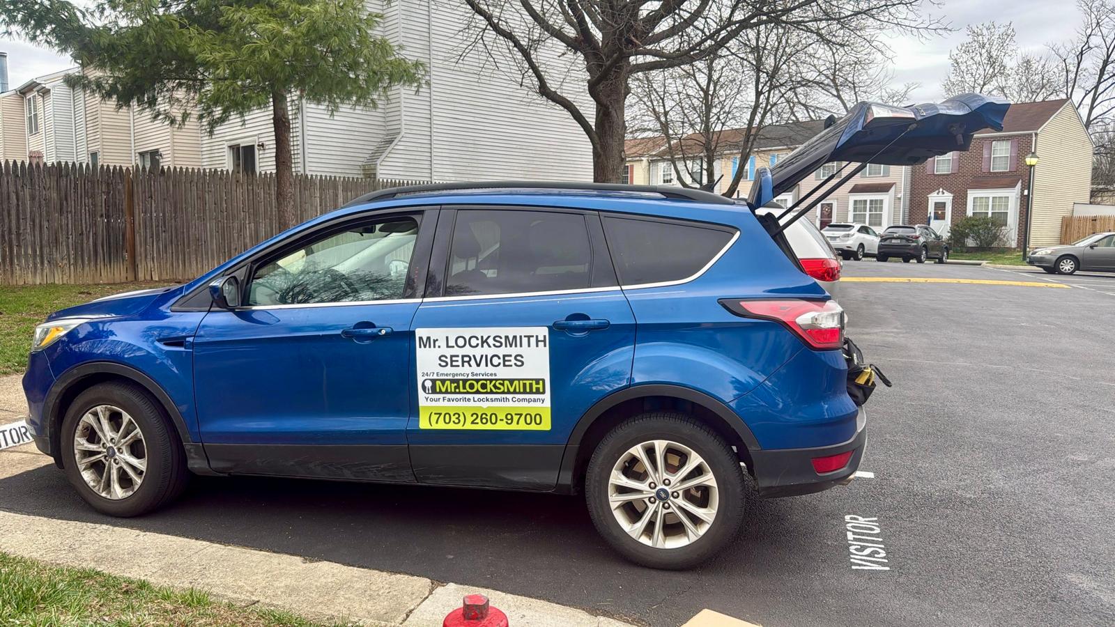 Mr. Locksmith Services vehicle showing the phone number (703) 260-9700